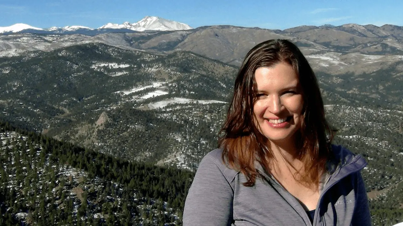 Gabrielle hiking in the Colorado mountains
