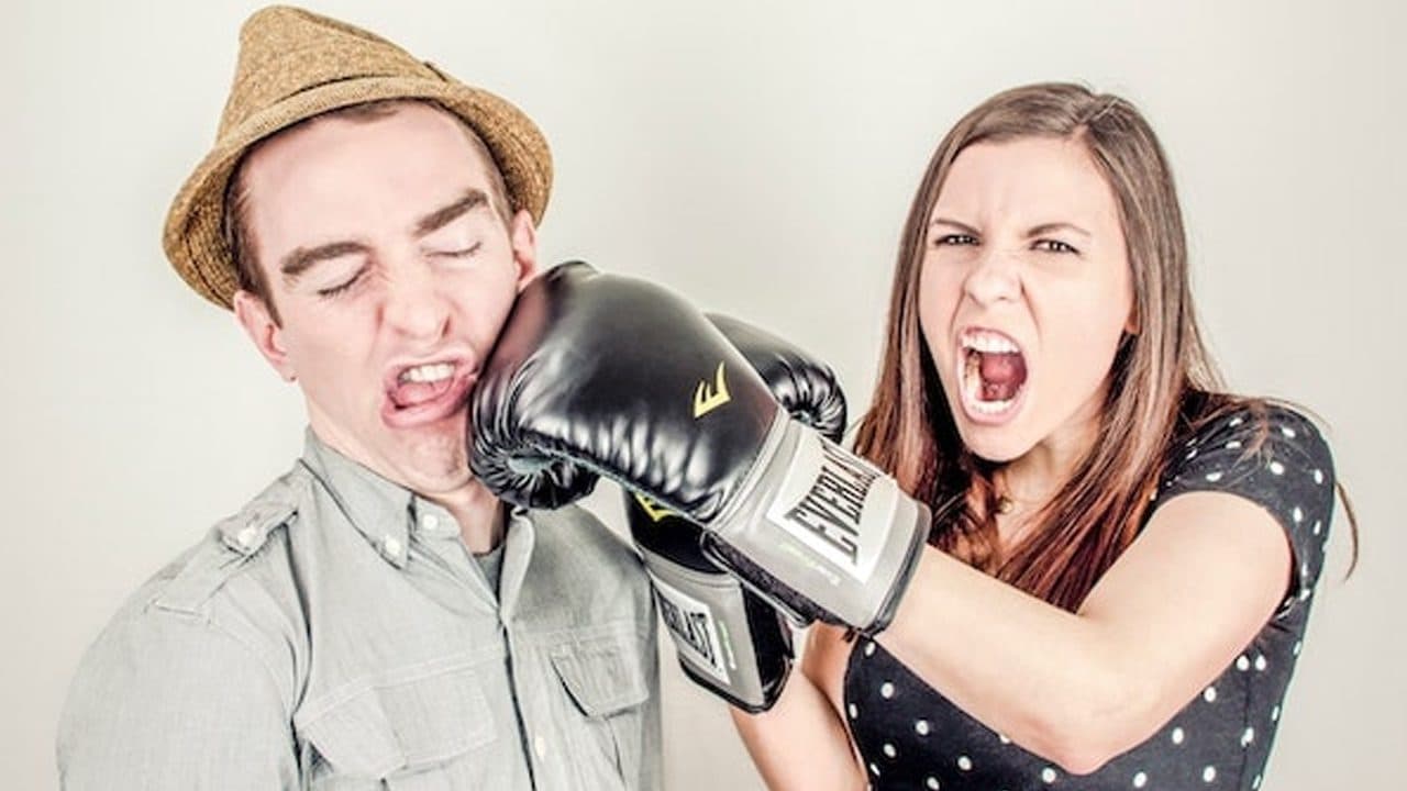 Couple fake boxing each other