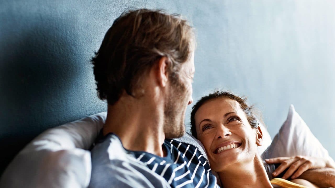 Engaged couple laughing together
