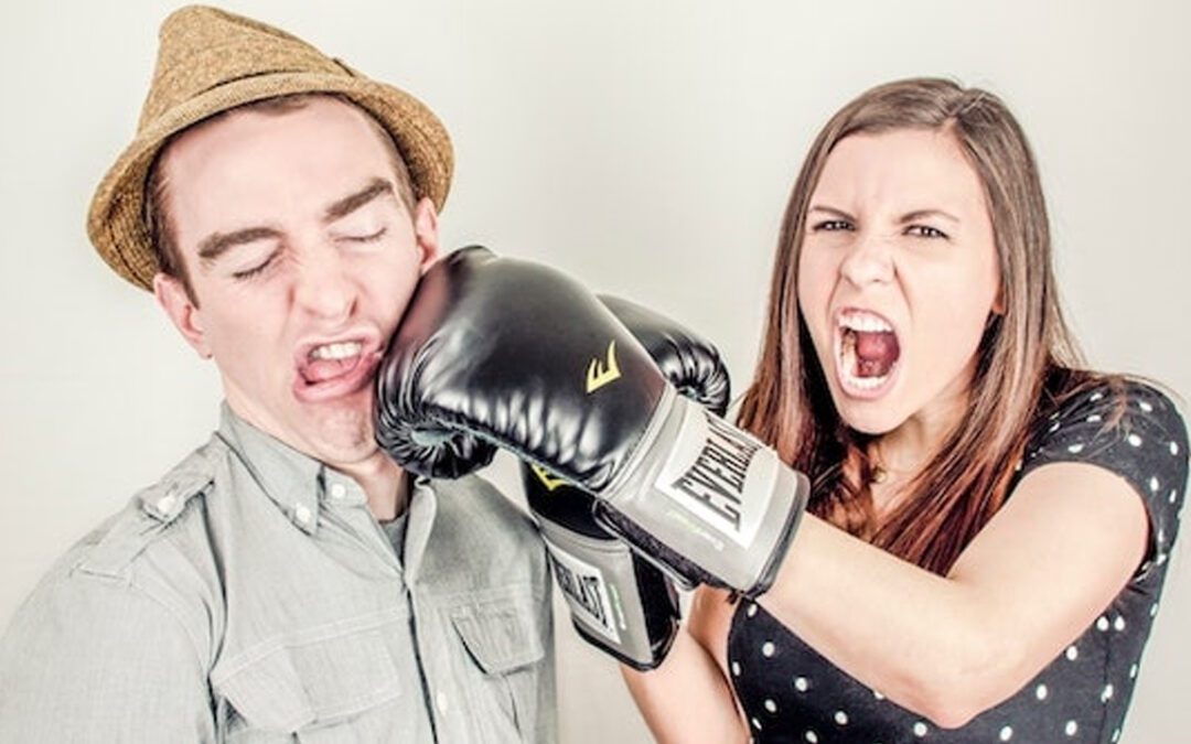 Couple fake boxing each other