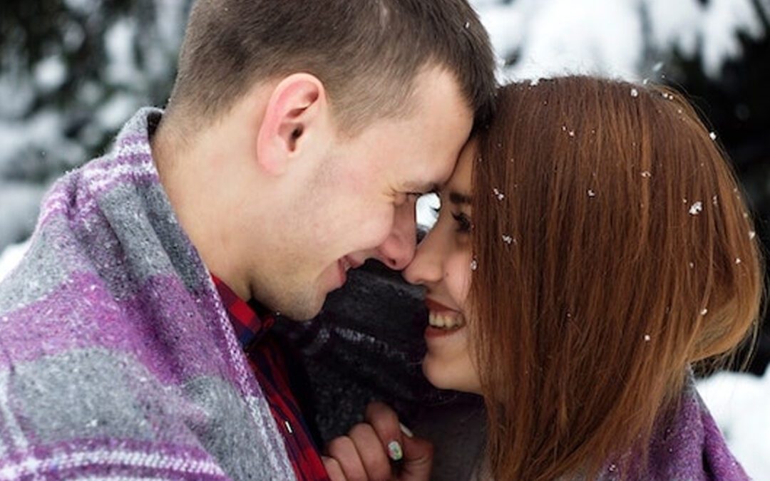 Couple embracing each other in the snow