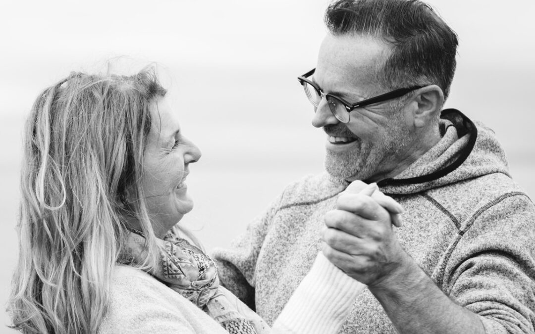 A happy and healthy couple dancing