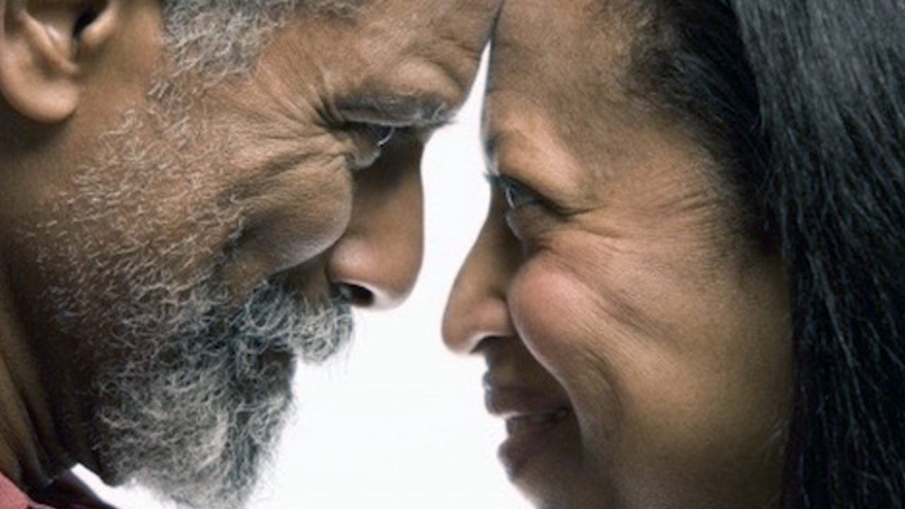 Married couple looking into each other's eyes