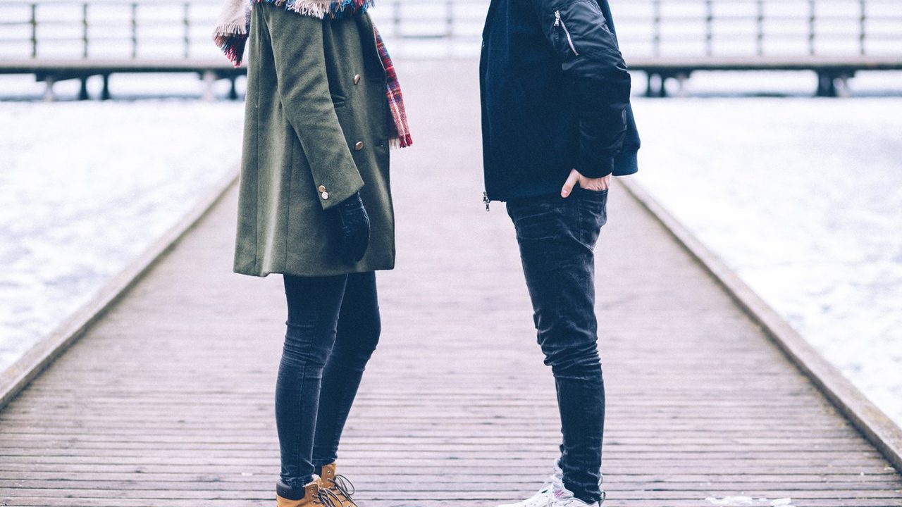 Couple standing outside talking