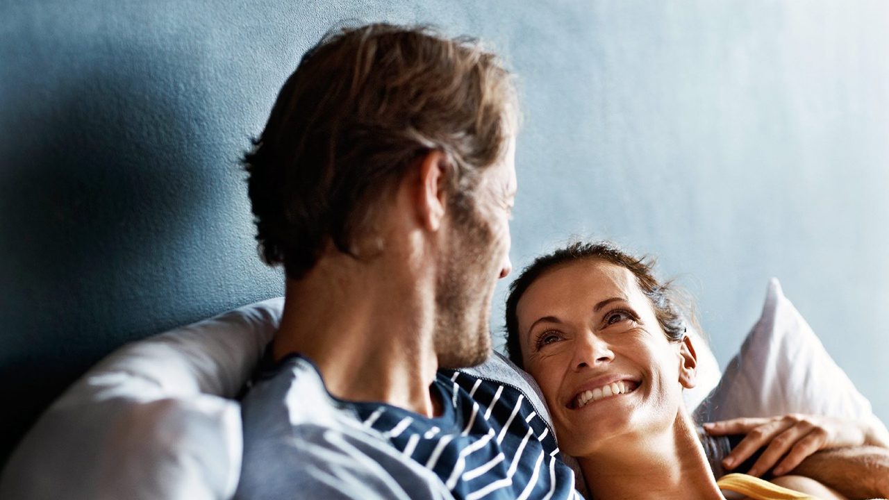 Engaged couple laughing together