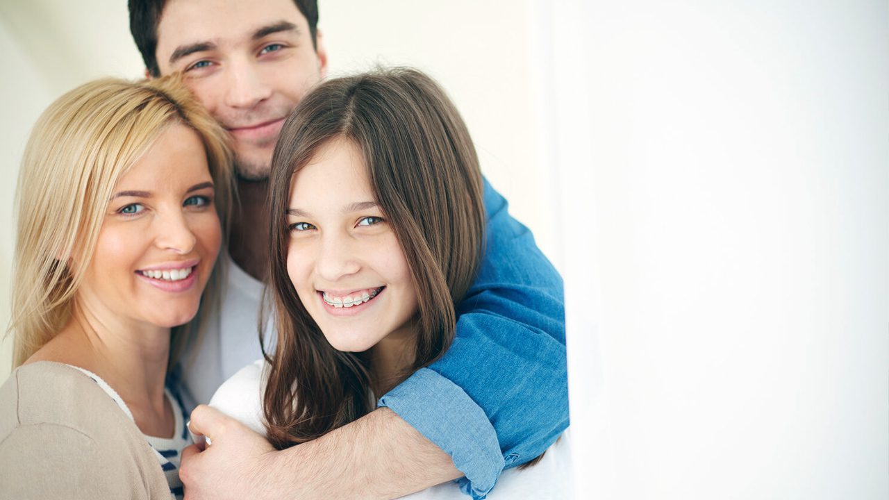 Family hugging and smiling together